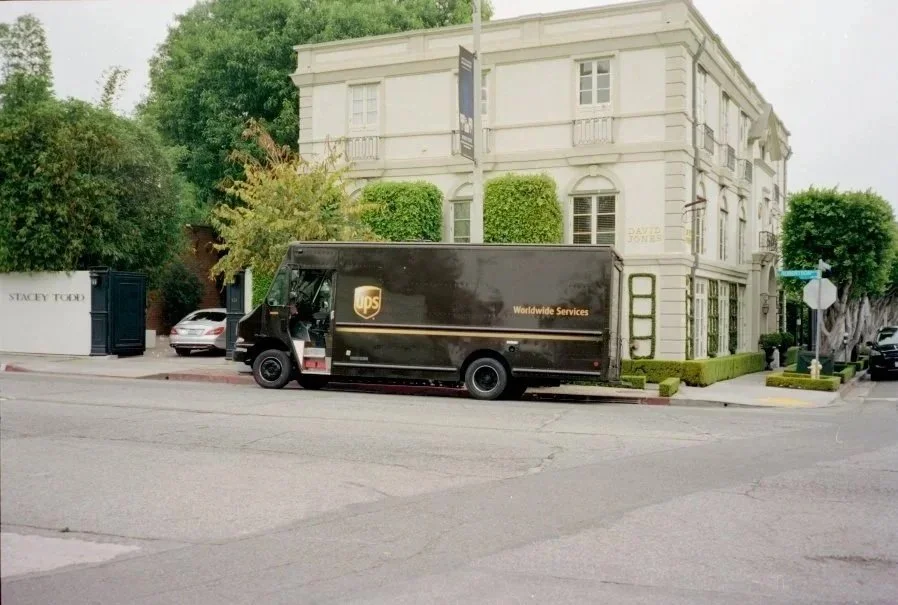 Classic scan sample: a delivery truck outside a white building, with a traditional lab look.