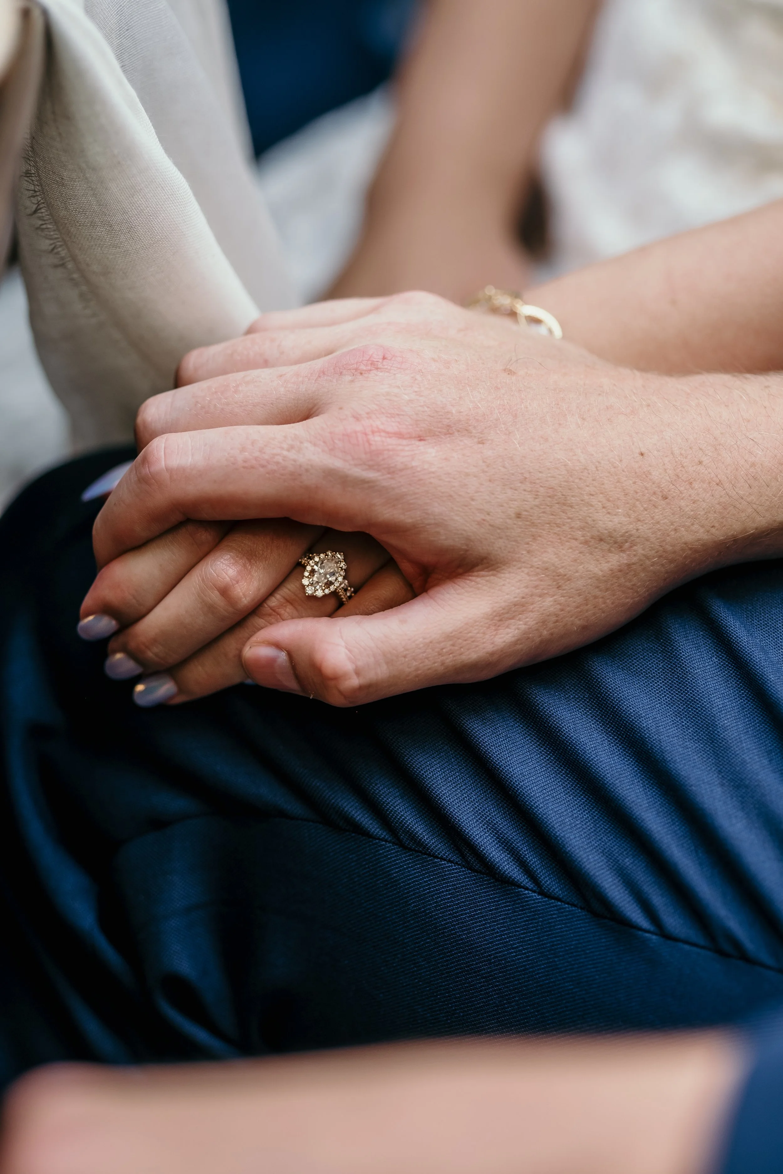 bride and groom hands at dinner