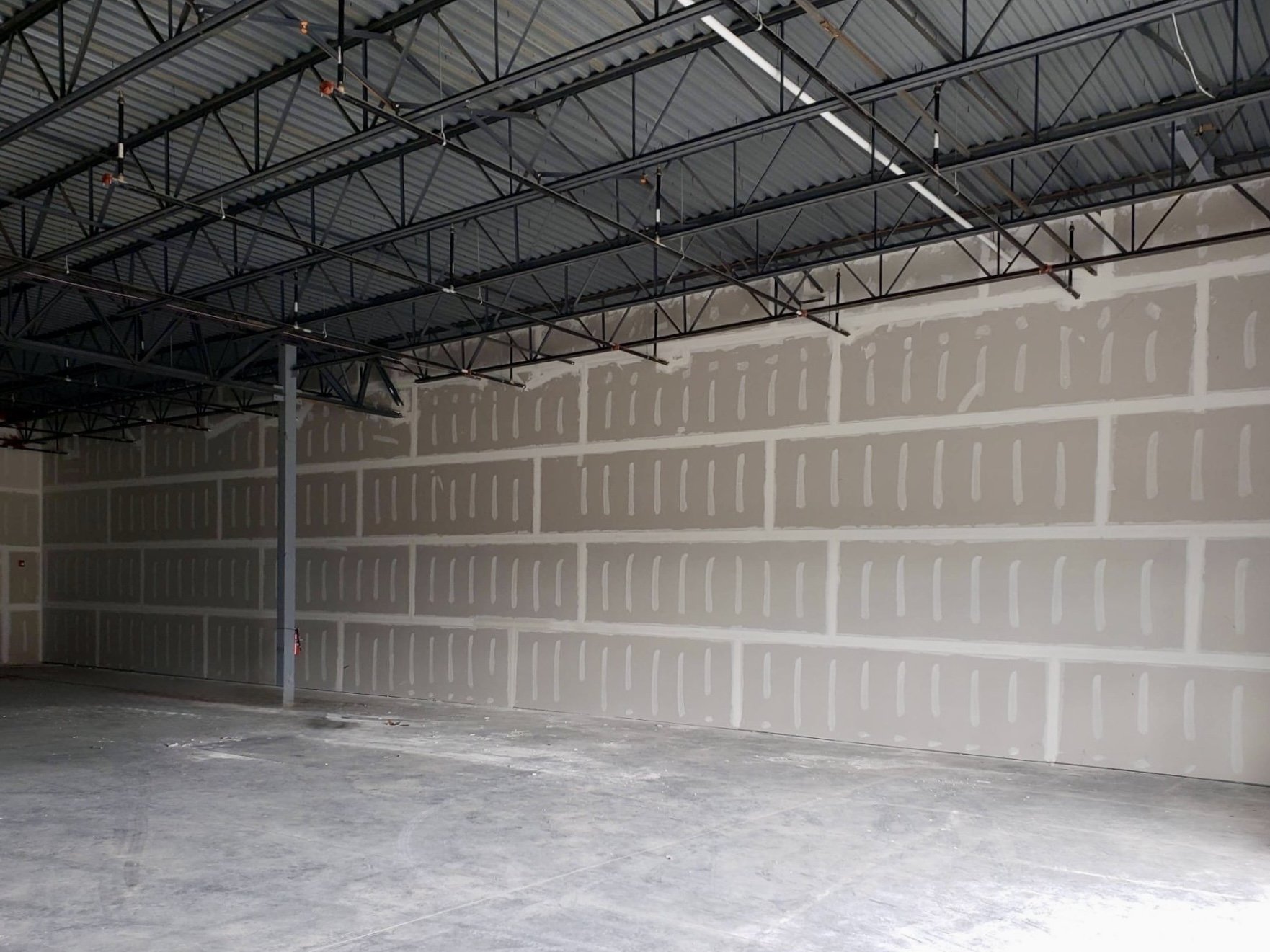 Commercial drywall installation in progress.