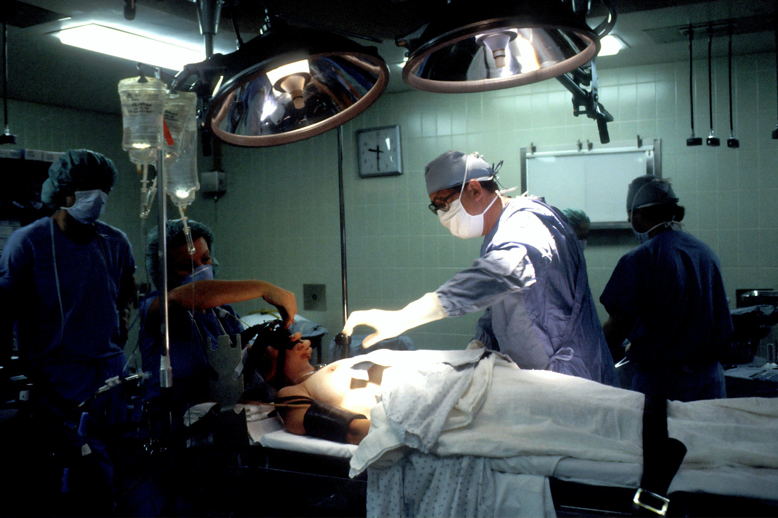 Anesthesia team caring for a patient in an operating room.