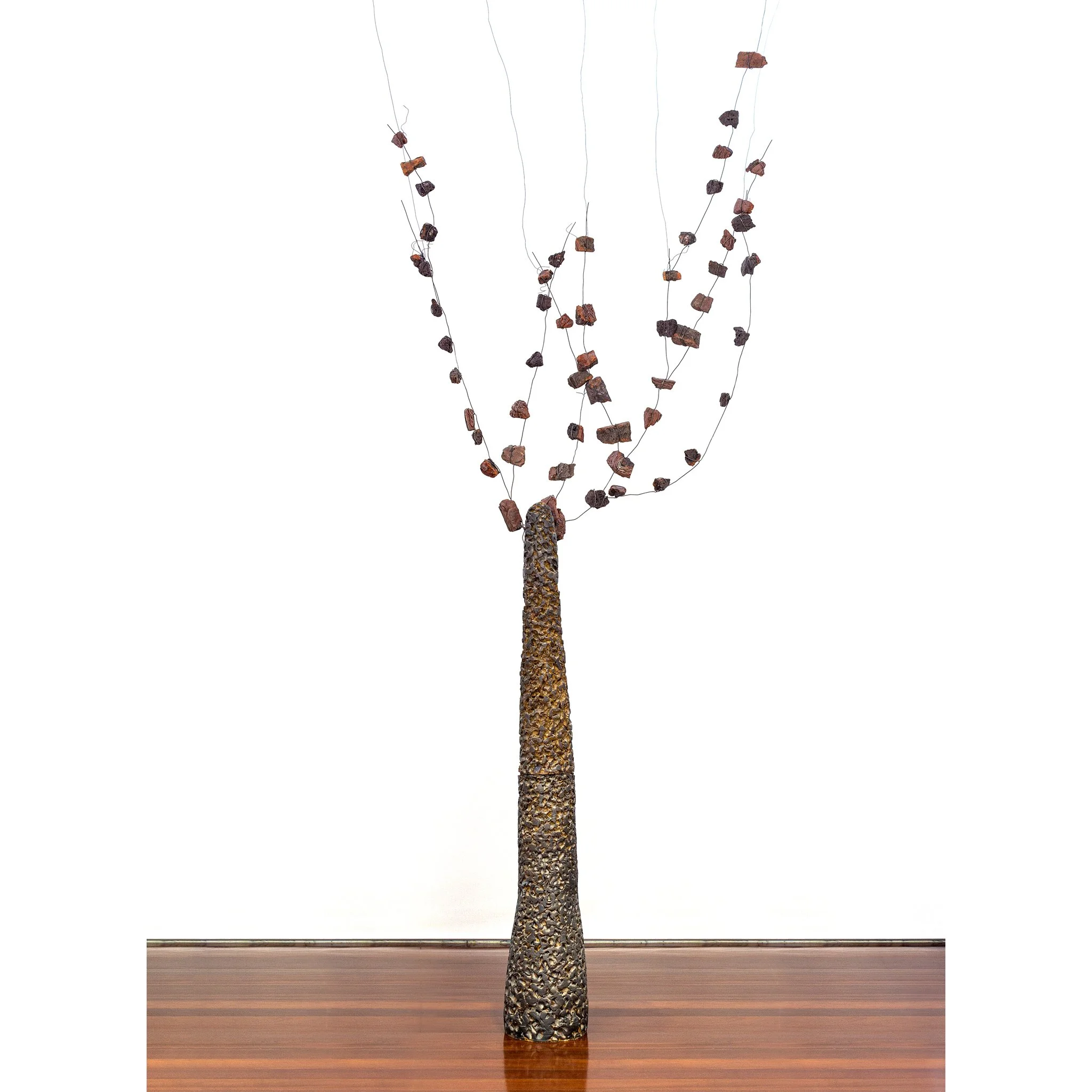 Refractory clay, oxides and glazes. Expanded slate stone fragments added to the final composition in situ, as suggested by the image. Fired at 1250ºC. 230 x 220 x 30 (cm) depending on the installation