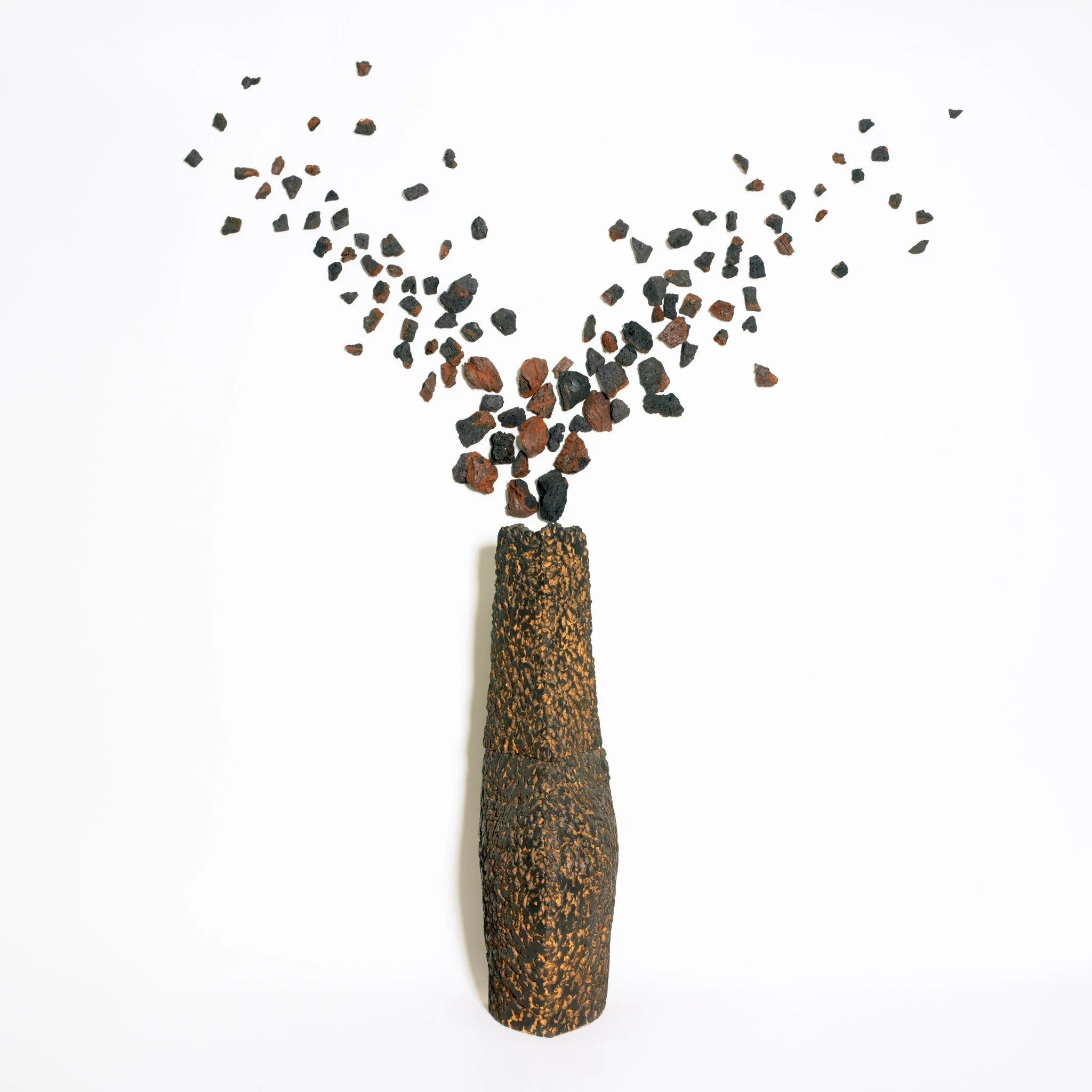 Refractory clay, oxides and glazes. Expanded slate stone fragments added to the final composition in situ, as suggested by the image. Fired at 1220ºC. 230 x 220 x 45 (cm) depending on the installation