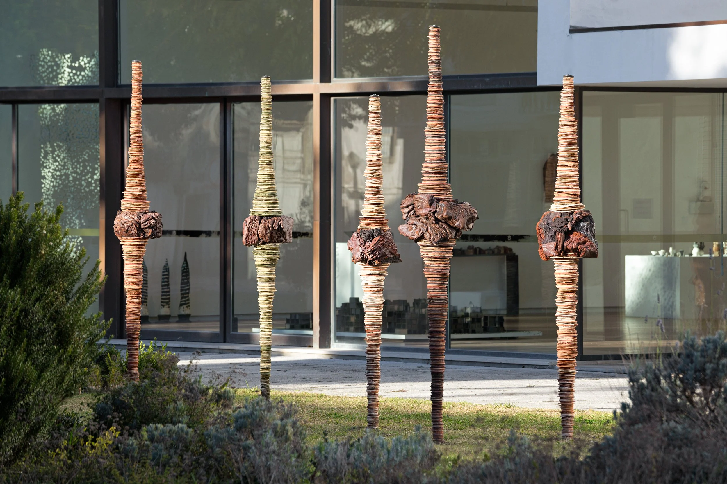 Pigmented clay and expanded slate fired at 1200ºC. 11 sculptures average 190 x 50 (cm) each