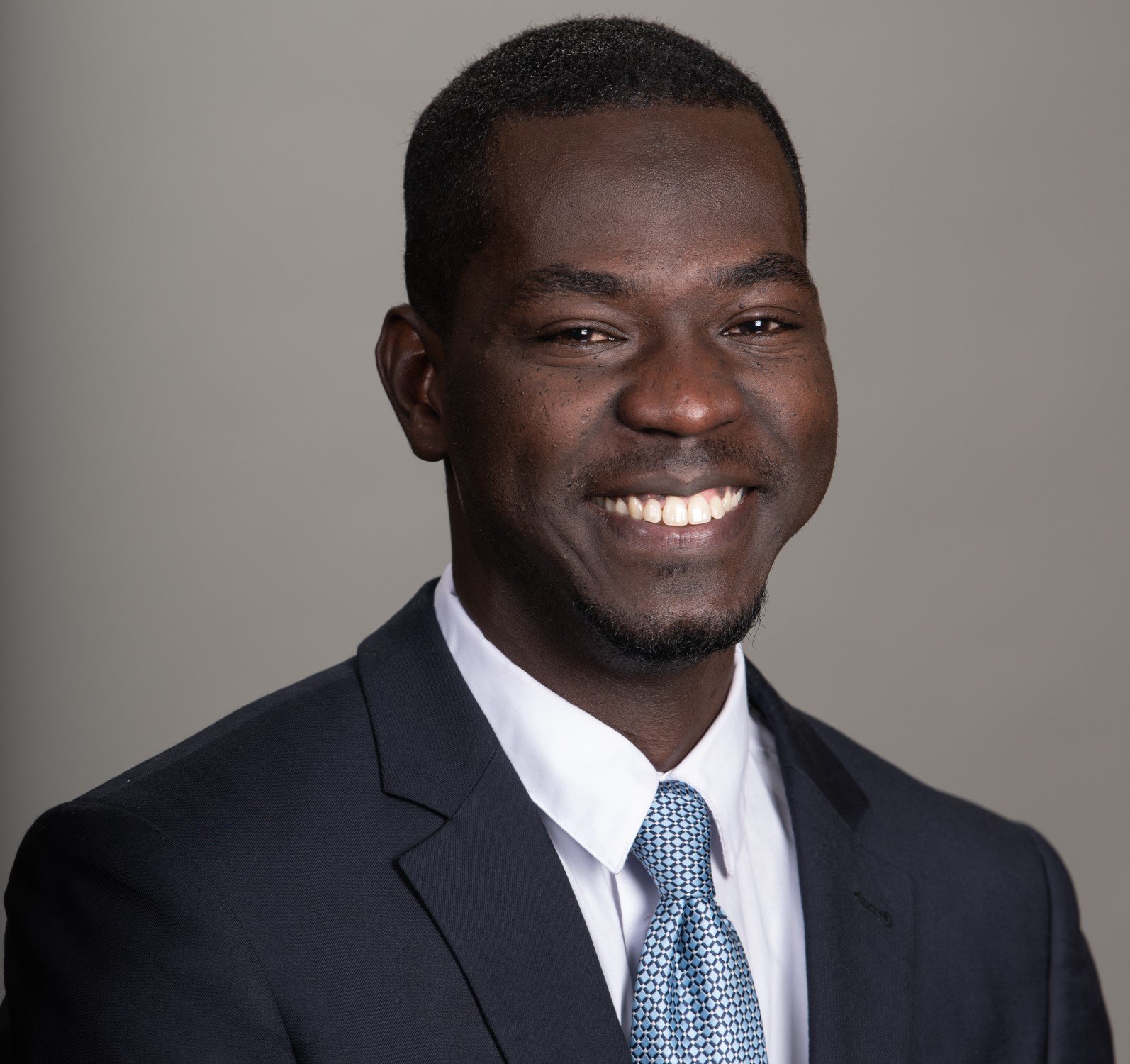 headshot of a smiling