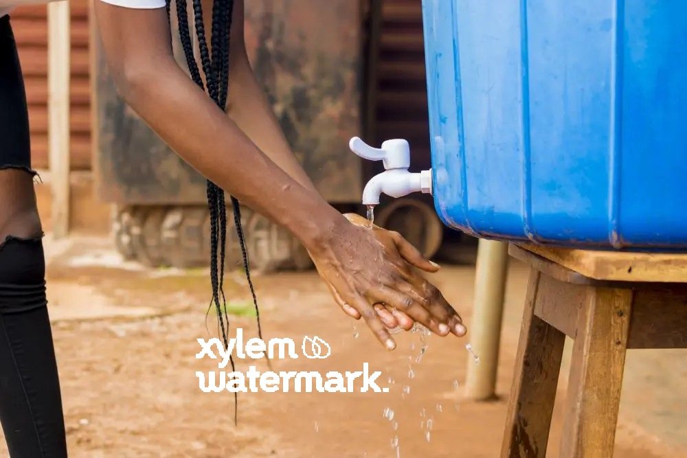 african-female-washing-her-hands-with-water - UNICEF + Xylem Watermark partnership