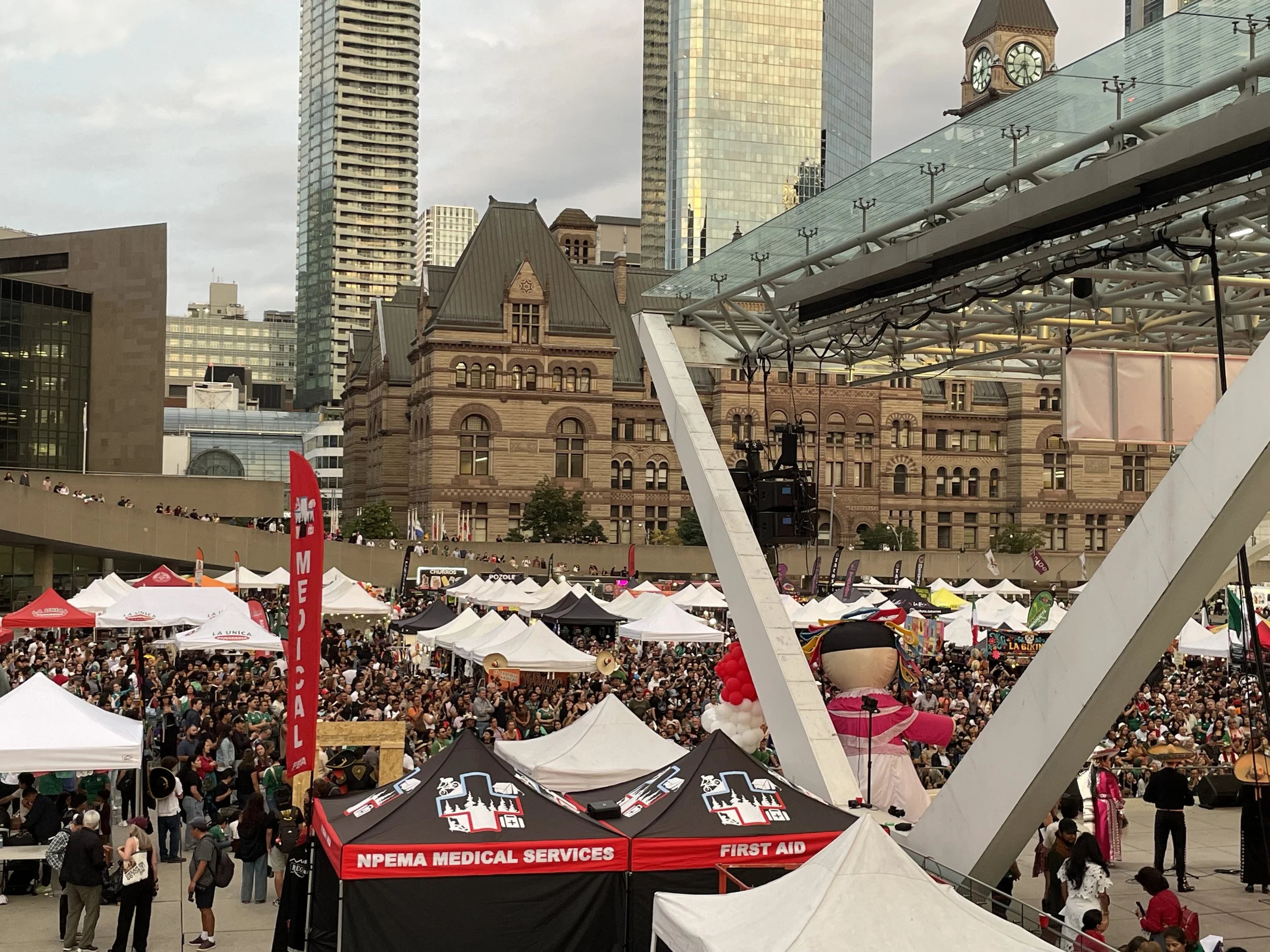 NPEMA event medical tents set up at multicultural festival with food vendor tents outside Toronto's city hall in the downtown core.
