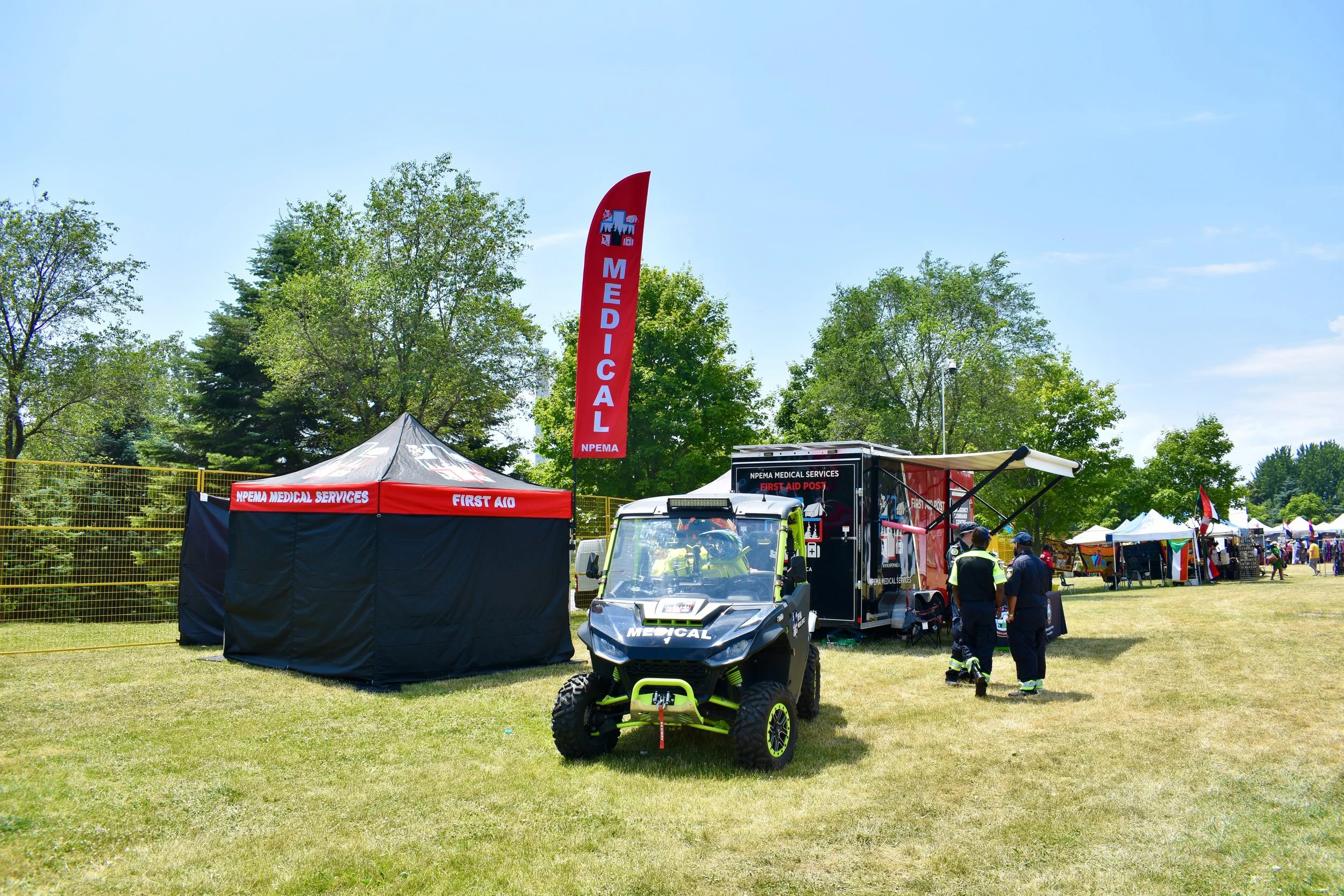 NPEMA Medical Services main medical tent, dispatch emergency command centre trailer,  and medical utility vehicle at an outdoor festival