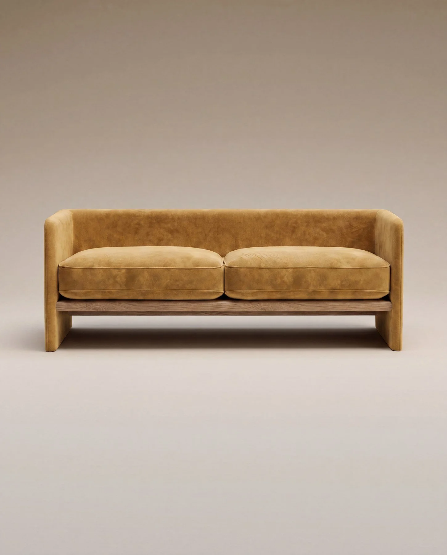 A beige velvet sofa with wooden legs against a plain light gray background.