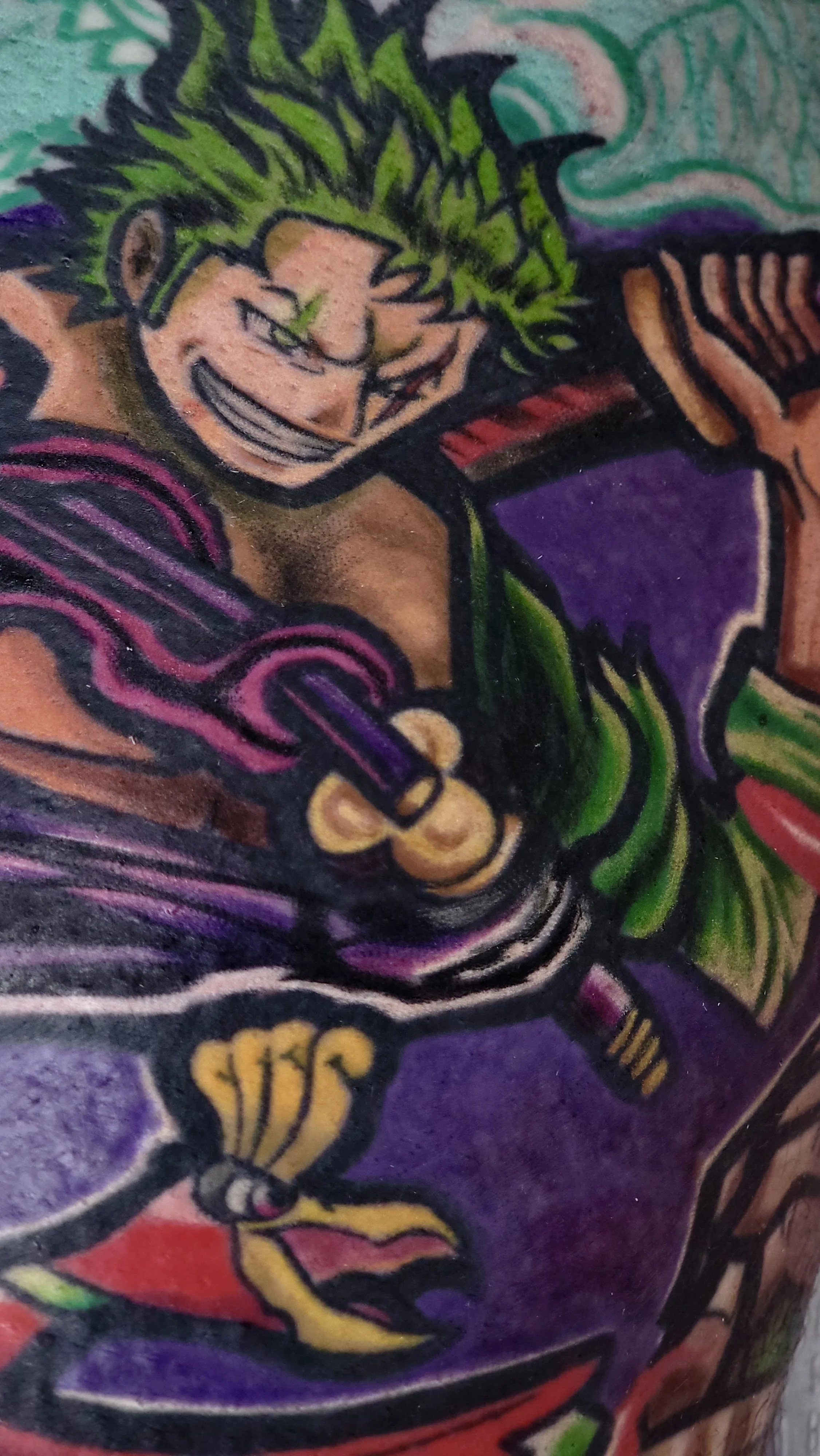 Colorful tattoo artwork featuring a grinning male character with wild green hair, holding a guitar, with vibrant purple, red, and yellow accents.