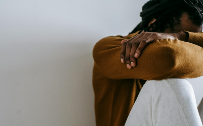 An individual experiencing workplace stress and anxiety, seeking confidential 1-on-1 personal coaching and active listening support.