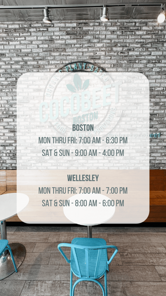 Sign displaying business hours for Cocobeet and Wellesley in Boston, located inside a cafe with a brick wall background and blue chairs.