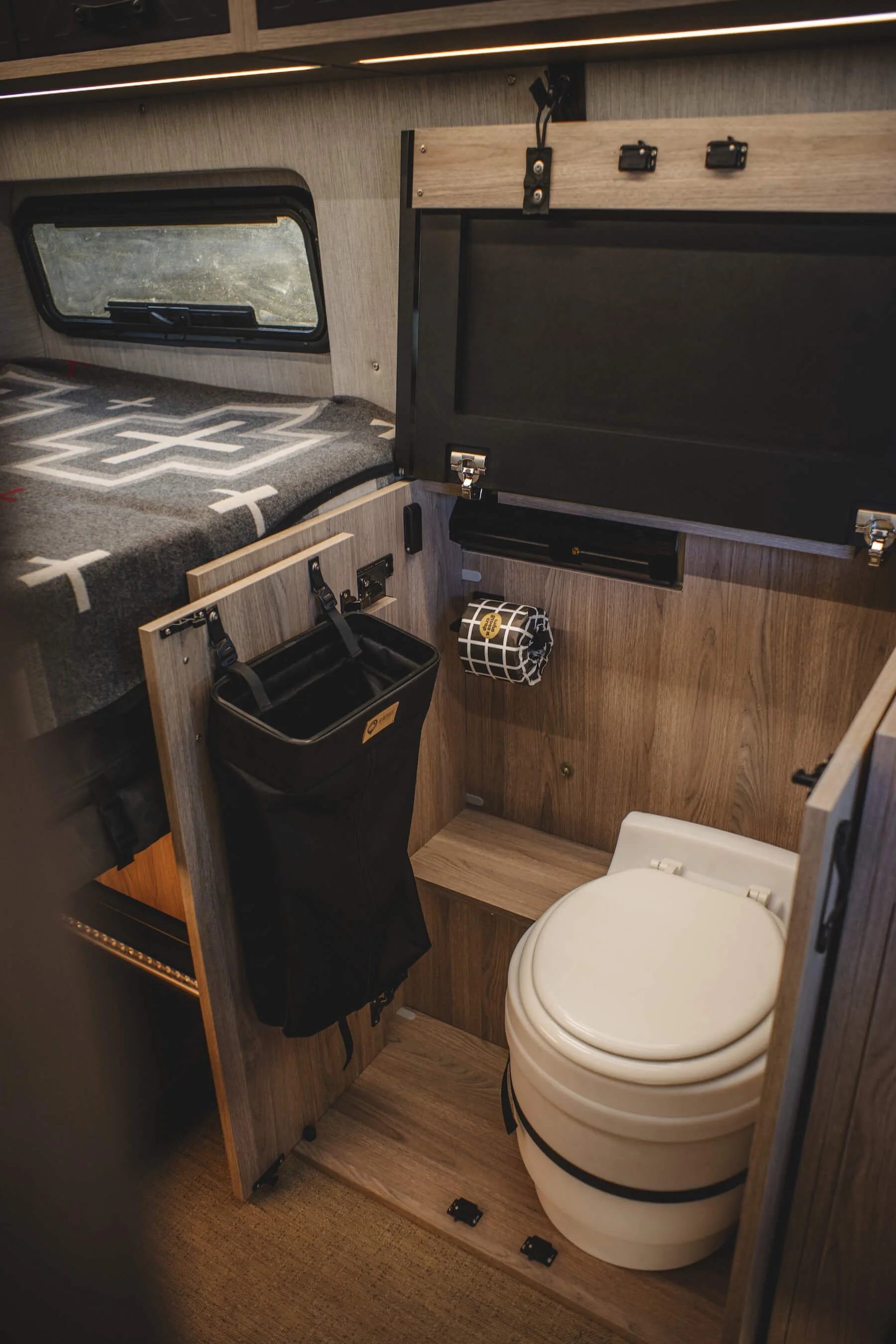 Easily Concealable Bathroom Cabinet for Sprinter Van.
