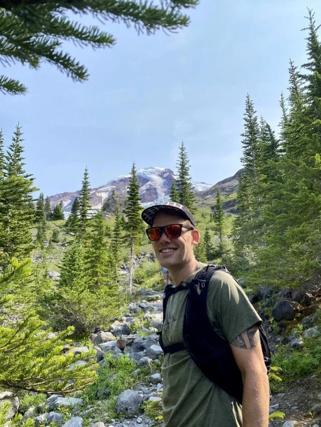 Image of Kyle Setzer hiking in the mountains