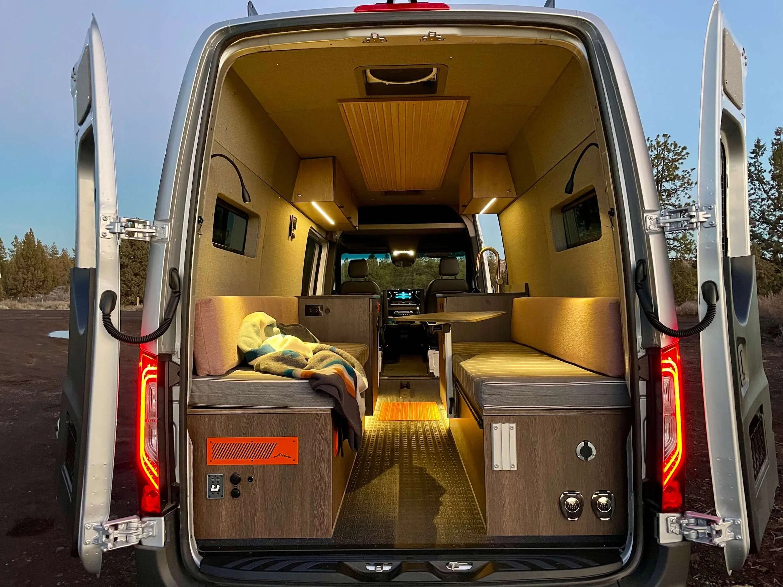 Rear view of 'Mrazak' sprinter 170 van with open doors, showcasing custom HWA interior design
