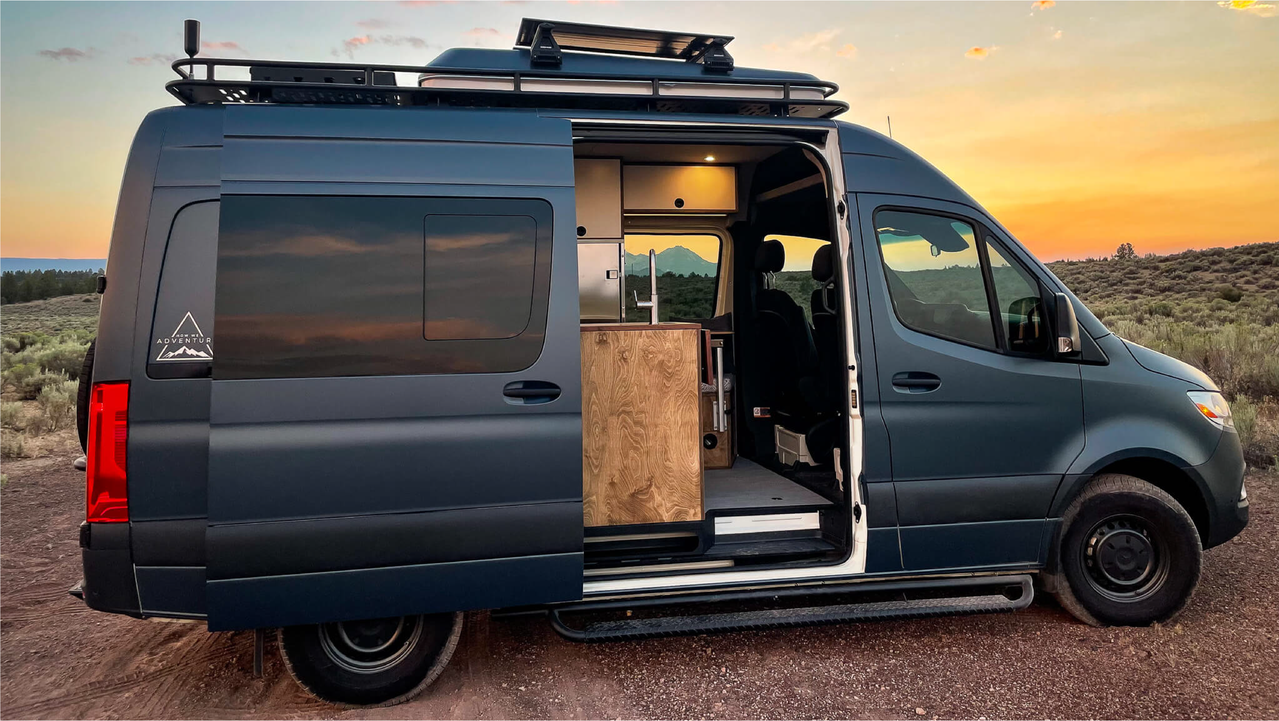 Side view of 'Skyliner' Sprinter 144 van with open rear doors, revealing custom HWA interior.