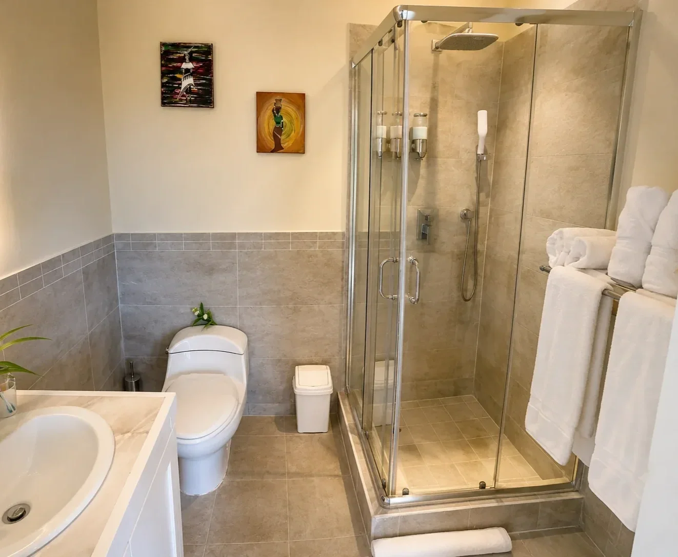 En-suite bathroom in the Memwa studio villa, with a glass shower and marble sink