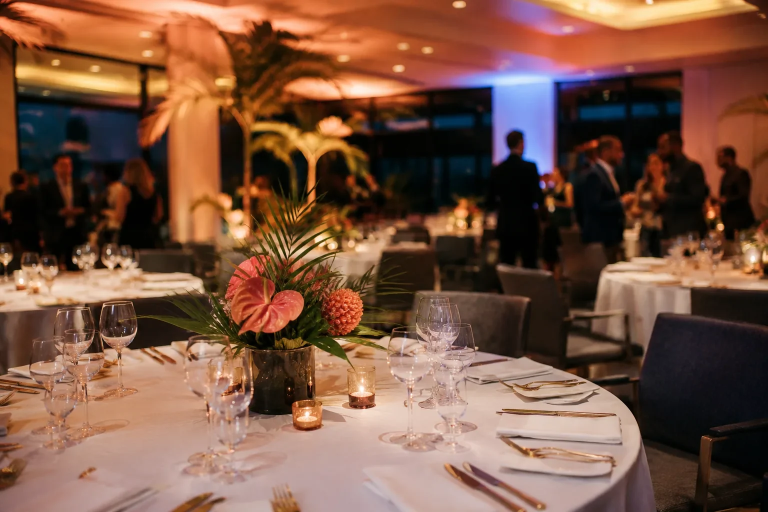 Corporate gala dinner with round tables and warm, dimmed lighting