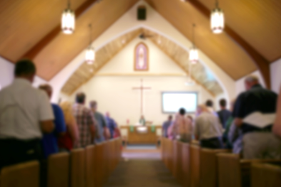 A congregation gathered inside a church sanctuary