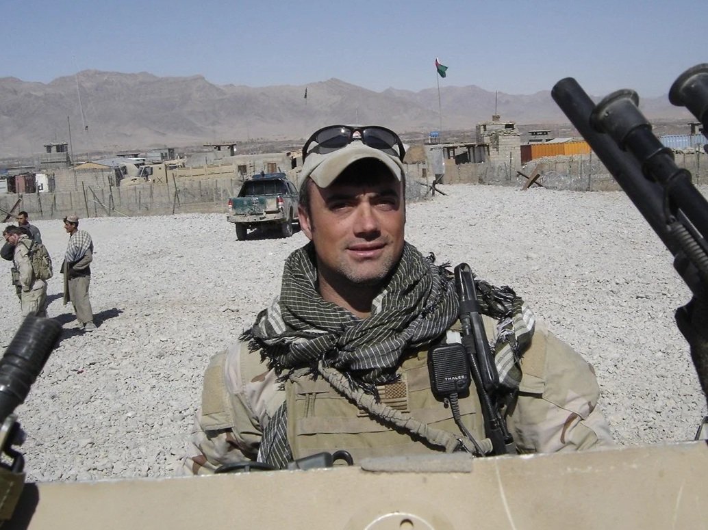 Robb Milheim beside the vehicles and positions his team shot from and took cover behind during daily firefights in Afghanistan