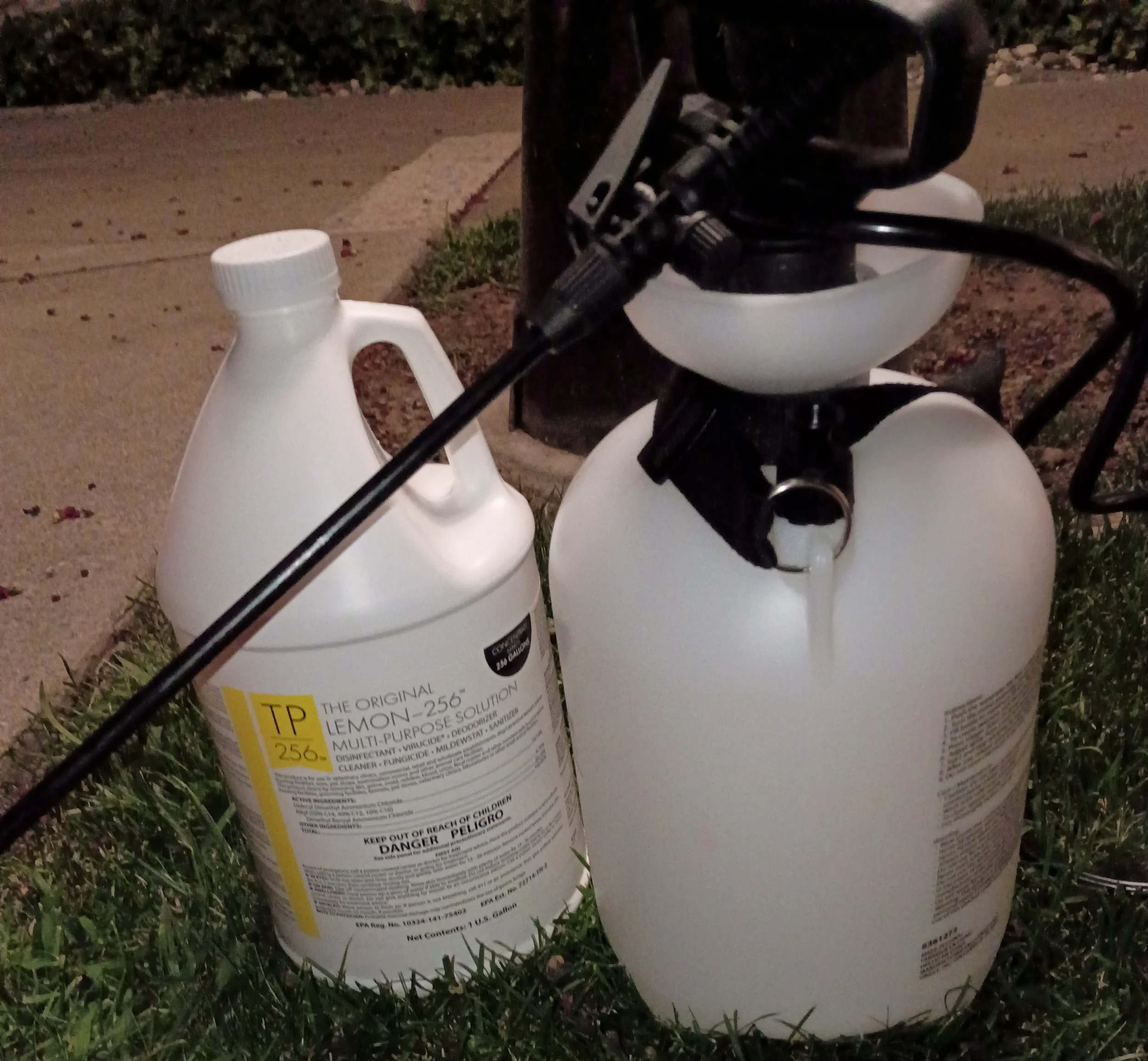 Top Performance 256 kennel-grade disinfectant and pump sprayer used by Poop Scoop Champion to clean scooping tools and boots between properties.