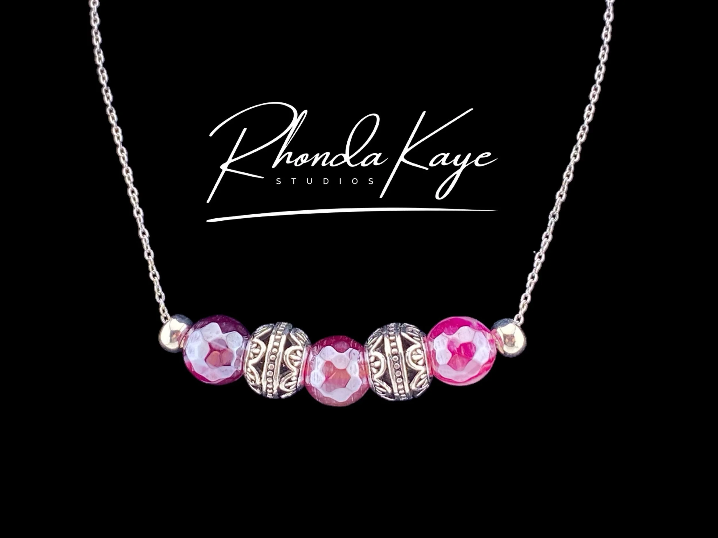 Dazzle Rose Necklace on black backgroun.jpg