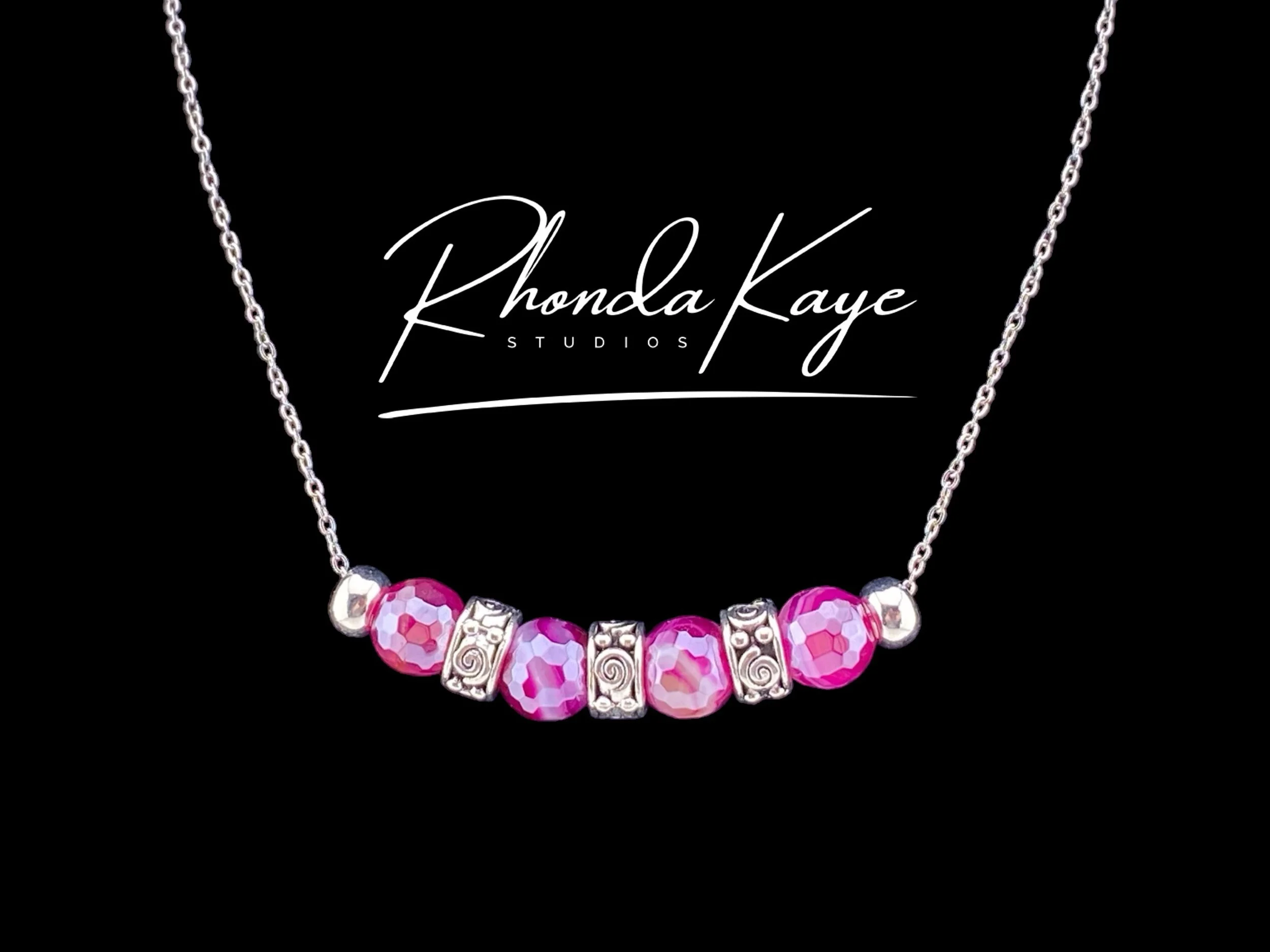 Razzle Rose Necklace Black background.jpg