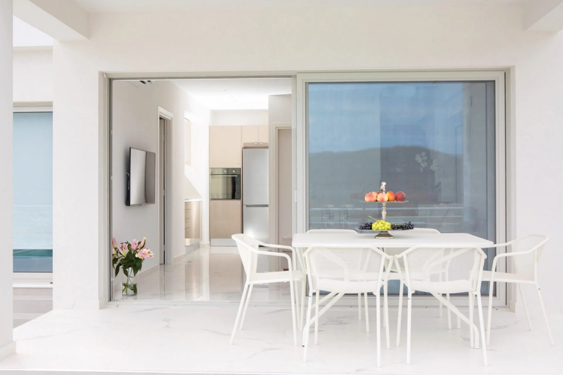 17-villa-o-offwhite-vasiliki-lefkada-greece-living-room-seating-area-balcony.jpg