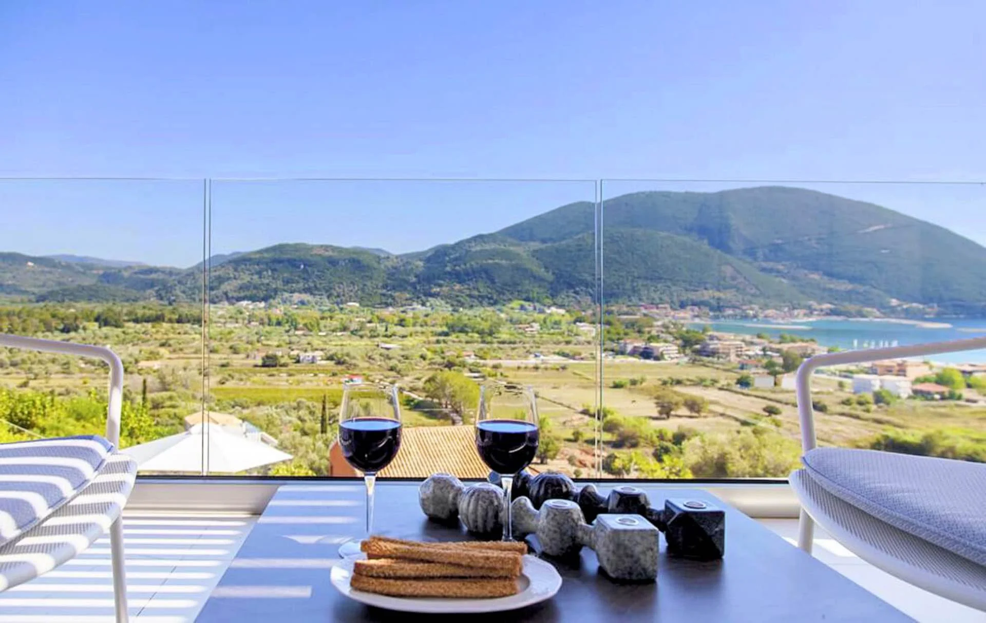 02-villa-o-offwhite-vasiliki-lefkada-greece-outdoor-balcony-veranda-seating-area-outside-furniture.jpg