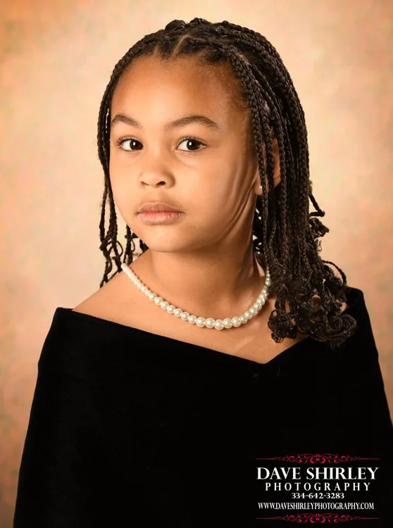Kindergarten studio posed in a black velvet portrait drape