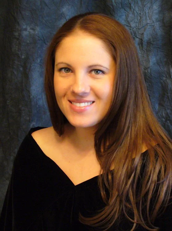 Front view of a black velvet senior poncho drape with a V-neckline