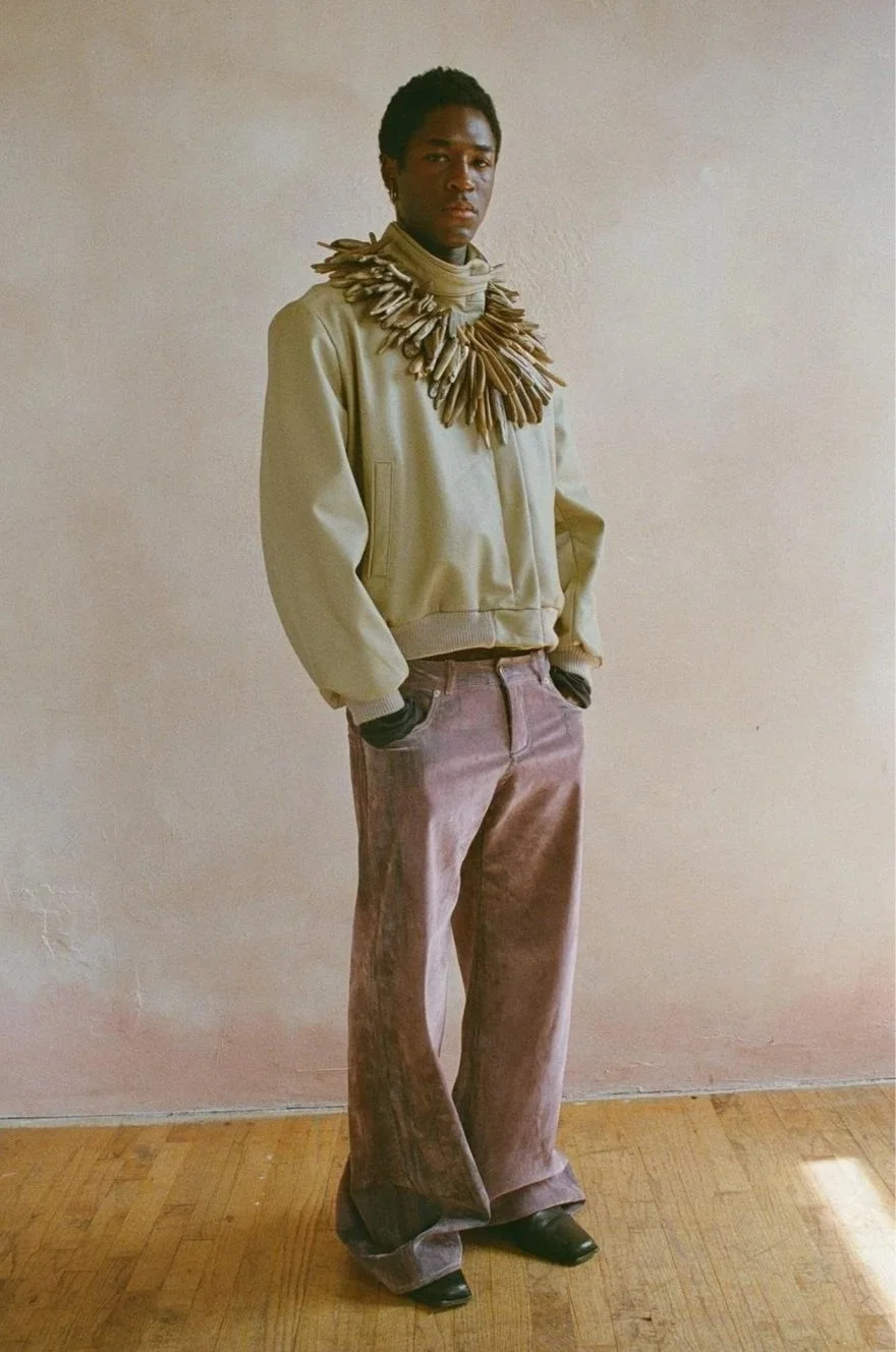 Driftwood Collar,
This look features collected pieces of driftwood, glossed, drilled and chained onto a cream reclaimed buckle leather bomber, and flocked denim jeans