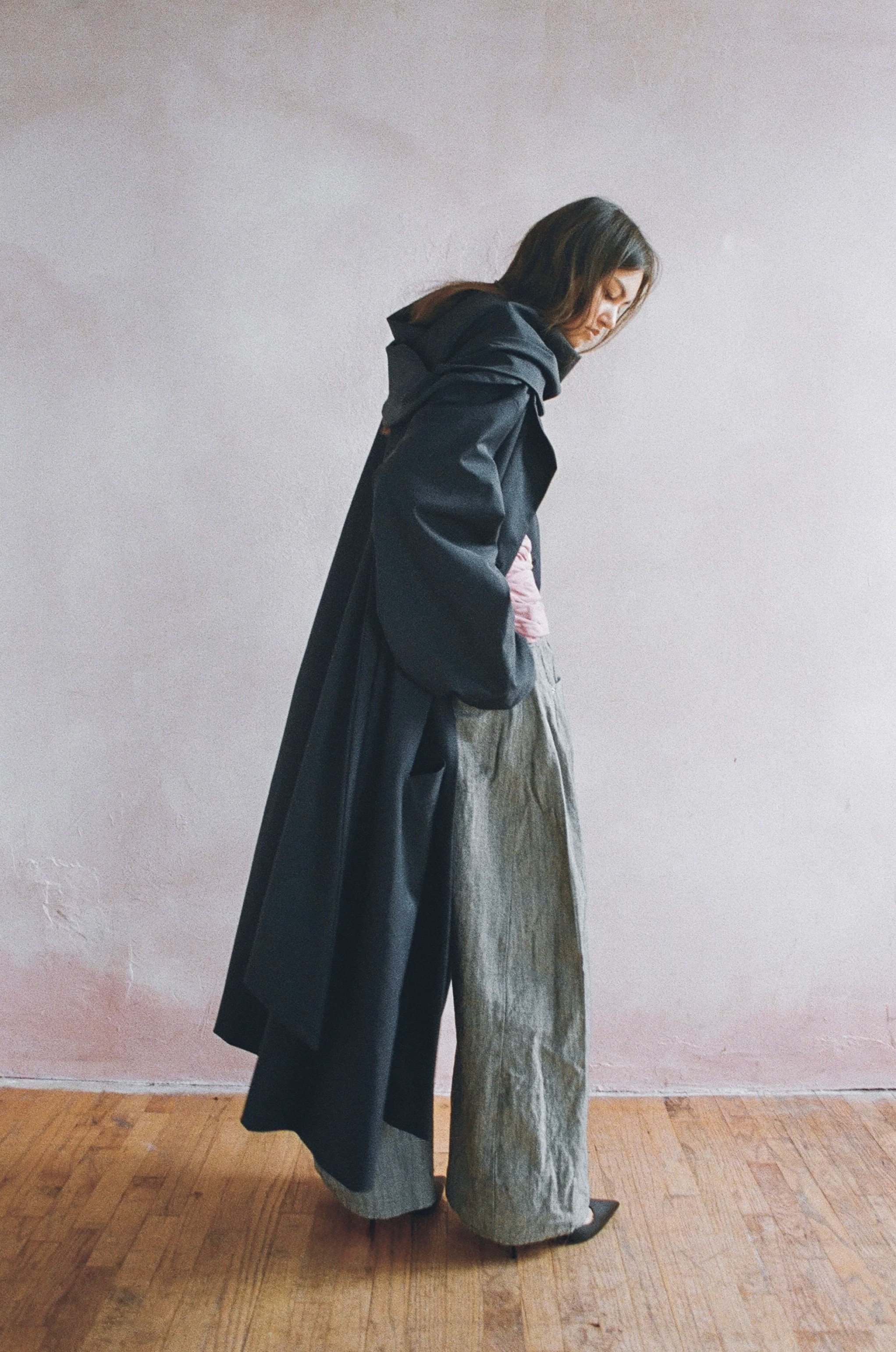 Water resistant trench with wrap vent scarf, and washed wrinkled jeans.