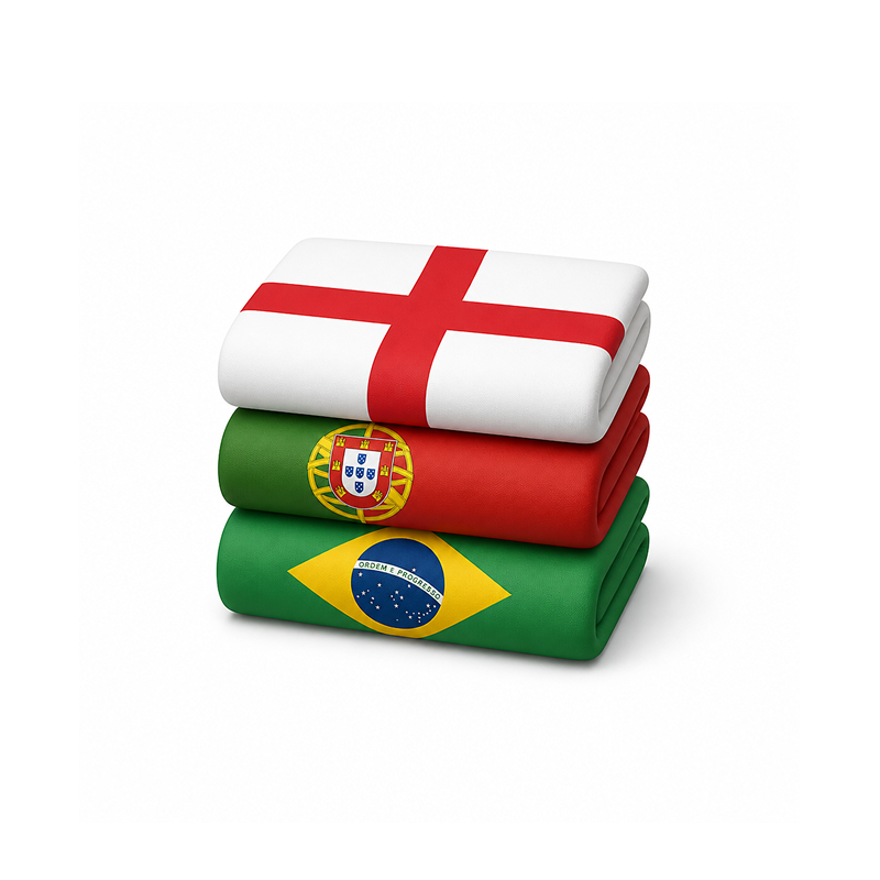 Stack of folded blankets with flags of England, Portugal, and Brazil from top to bottom.