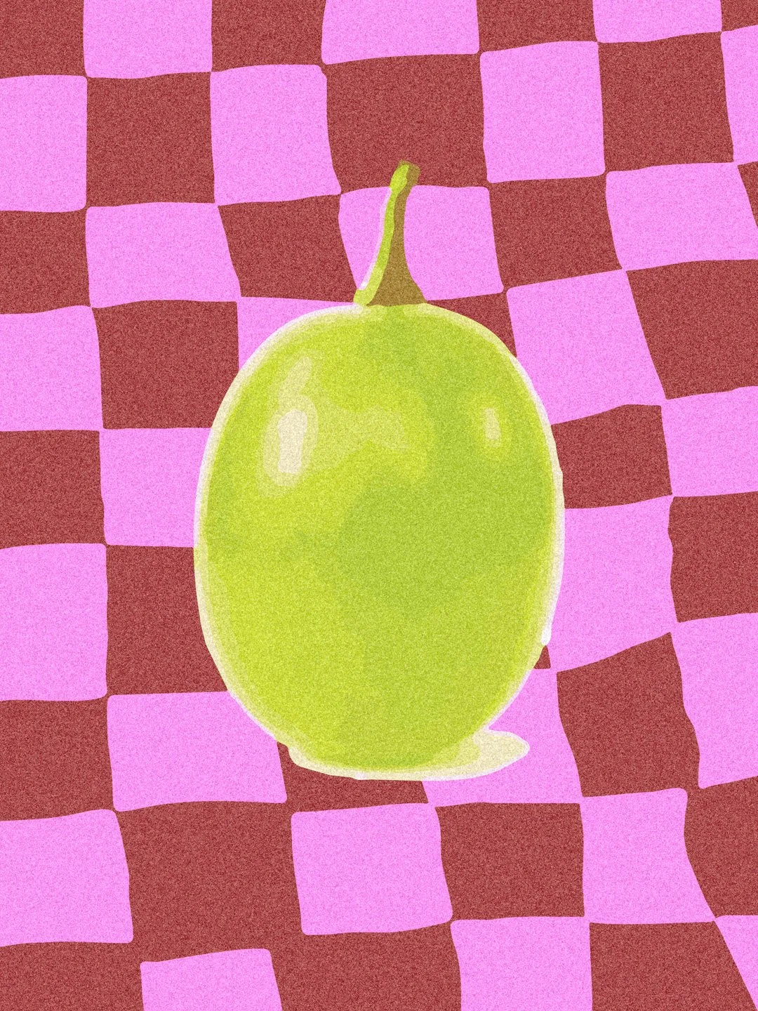 A green lime on a checkered pink and brown background.