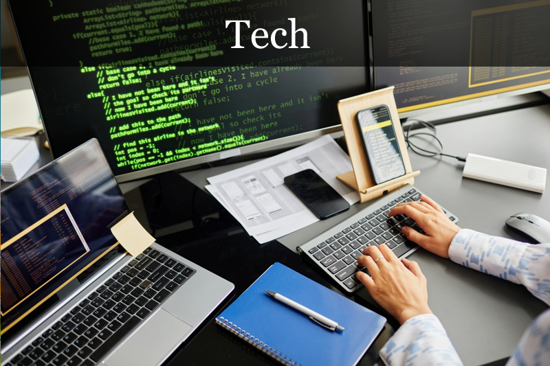 hands working at a computer - code on screen