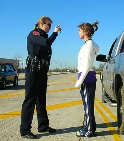 Officer Lisa Martin administering a horizontal gaze nystagmus test during a traffic stop