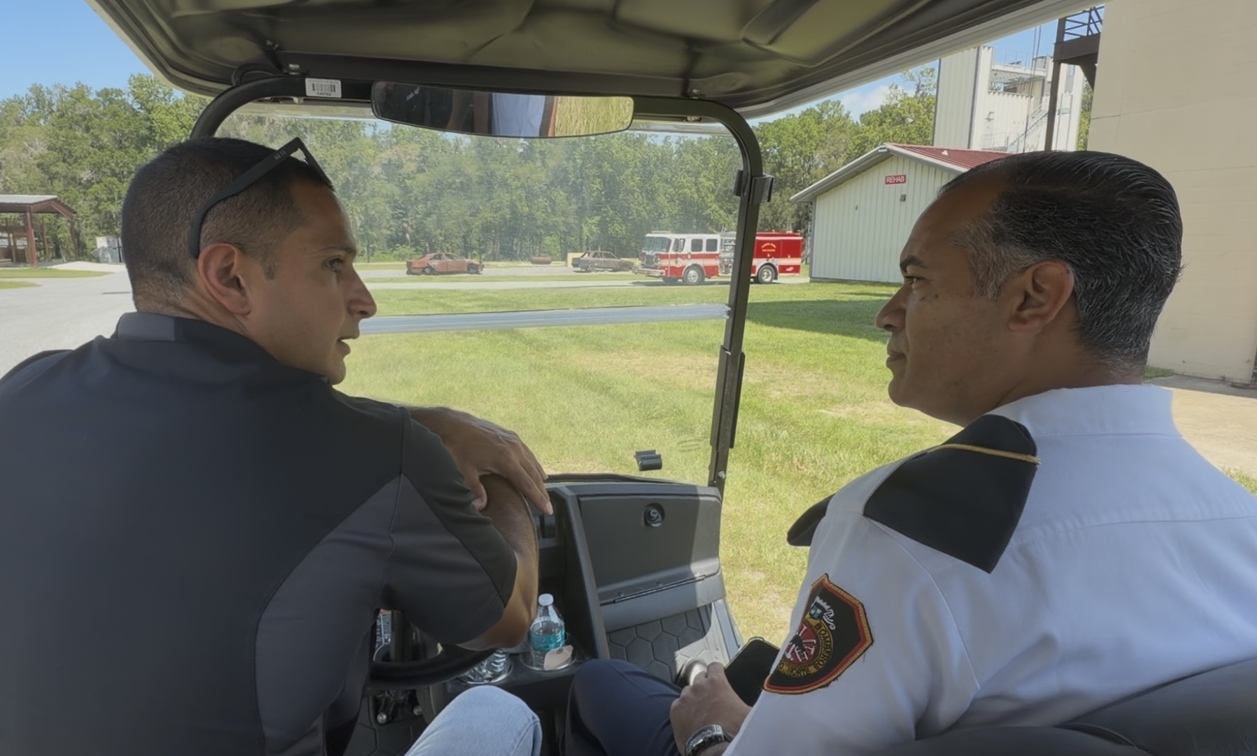 Strategic Training Exchange | August 18, 2026: 
Jose Paredes, Fire College Instructor (left), and Jose Martinez Brito, SDN Fire Department Subcommander (right), discussing academy development at the Florida State Fire College.