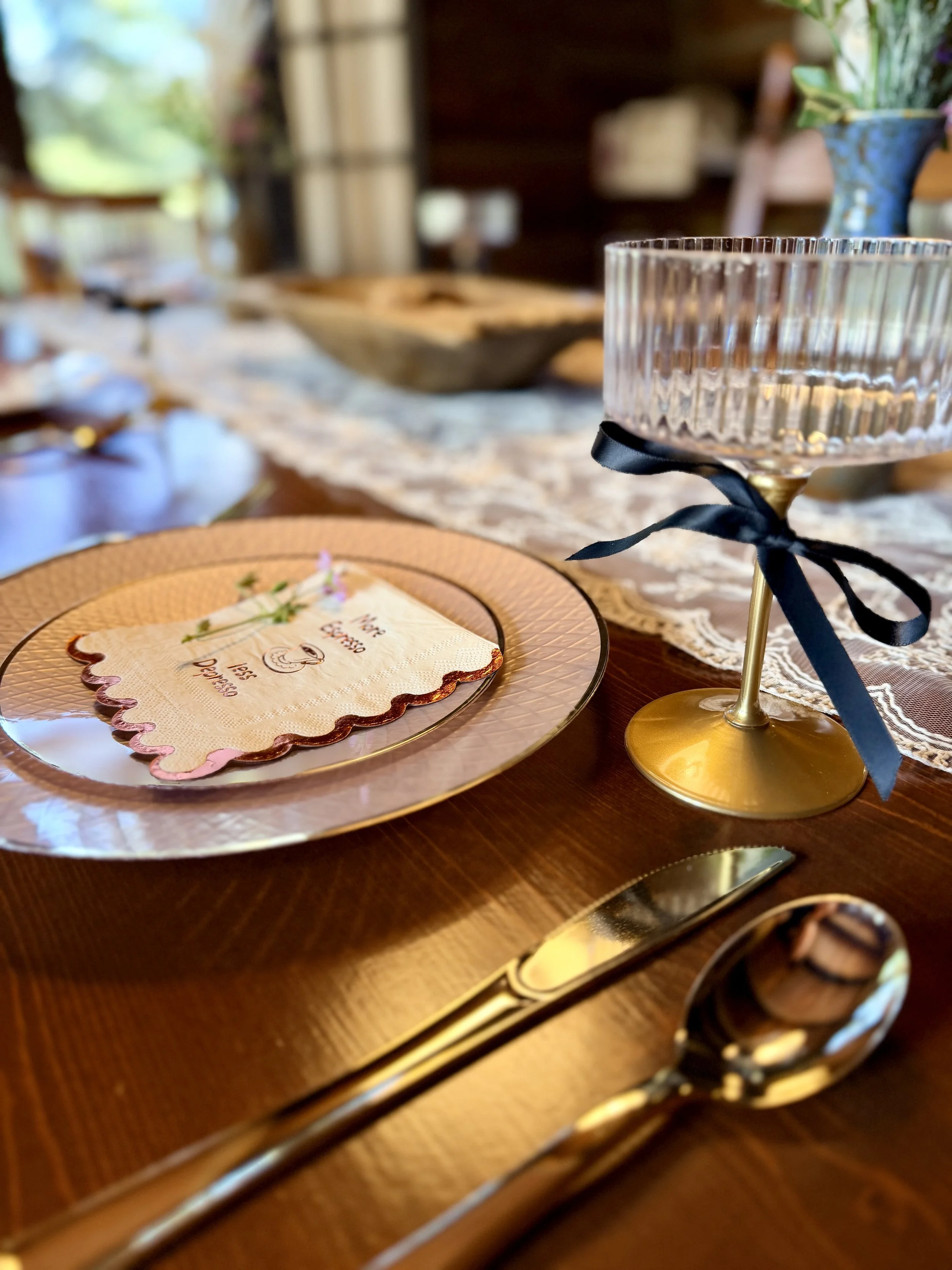 Elegant personalized place setting with custom name card, glassware and coordinated table decor for a celebration