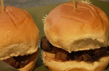 Gourmet mini sliders served warm at By The Wayside cocktail bar in East End Houston