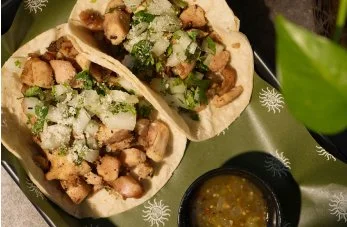 Authentic street tacos served with fresh cilantro, onions, and salsa on Wayside Bites menu at By The Wayside Houston