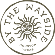Circular logo with the phrase 'BY THE WAY SIDE' around a stylized sun or face, and 'HOUSTON TEXAS' at the bottom.