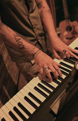 Musician performing live piano and music set at By The Wayside live music venue in East End Houston