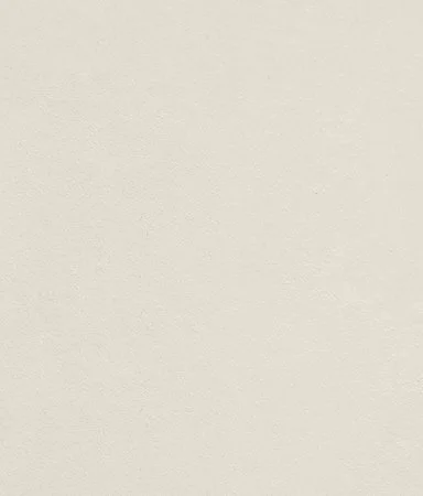 Plain light-colored wall with a smooth texture.