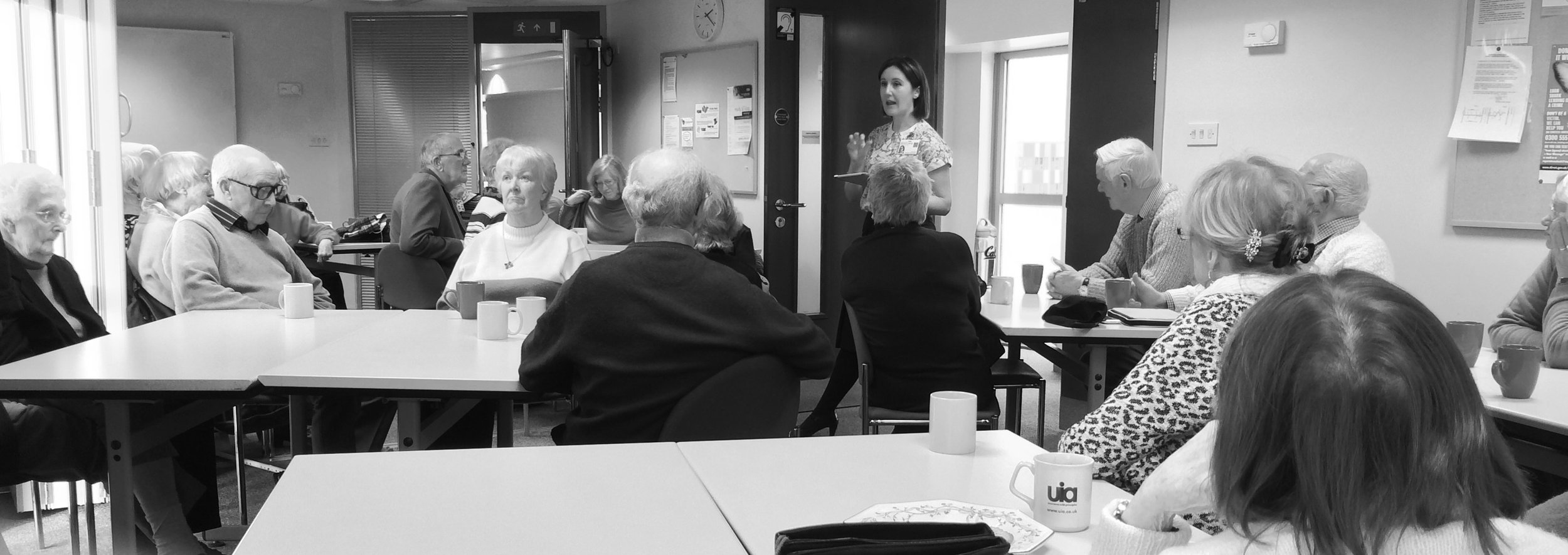 Sarah Peaceful speaking to older adults at a community event about healthy aging and independent living.