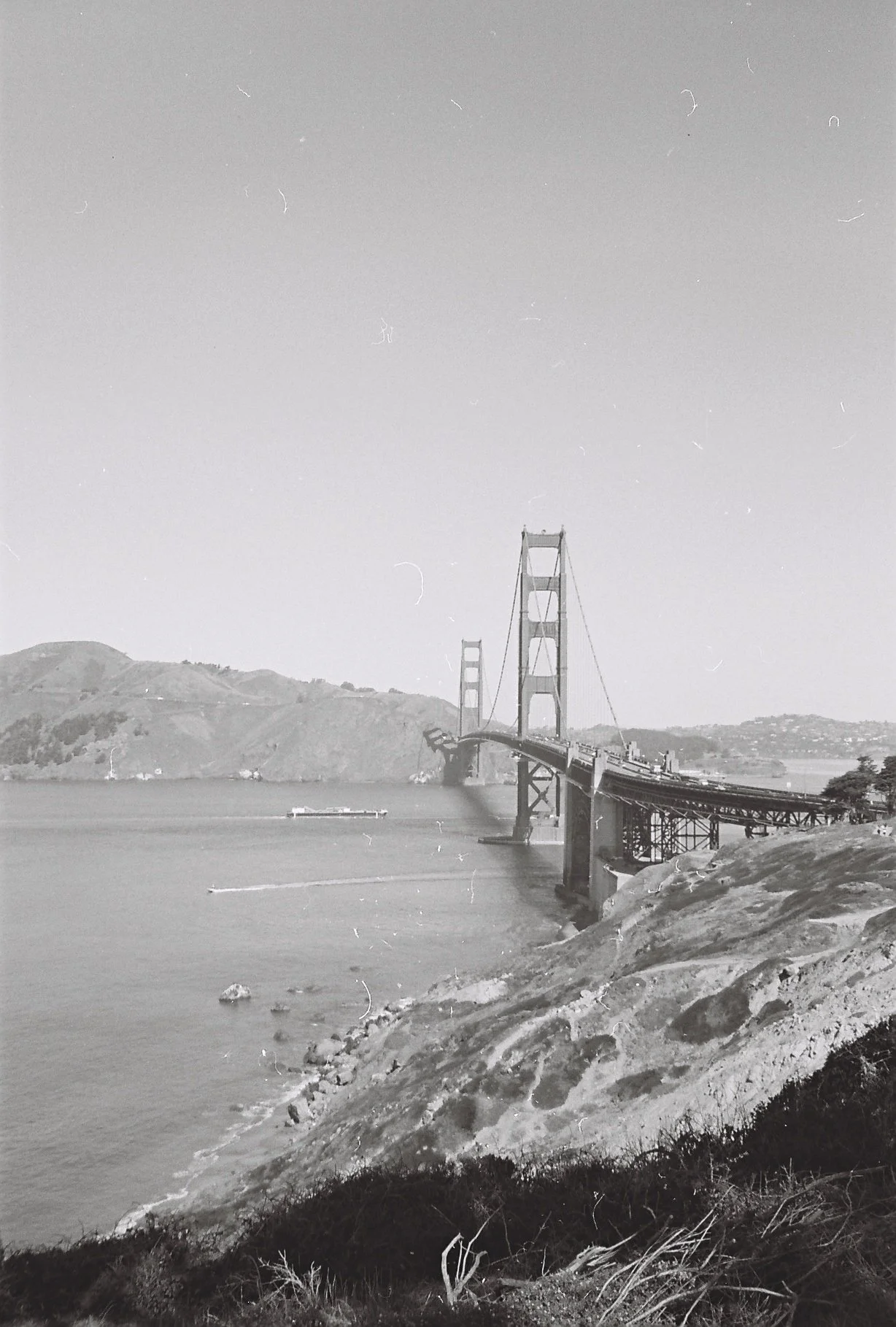 A black and white film photo of the Golden Gate Bridge in San Francisco, California.
