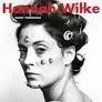 Black and white portrait of a woman with vintage hairstyle, text 'Harold Wilke' at the top.