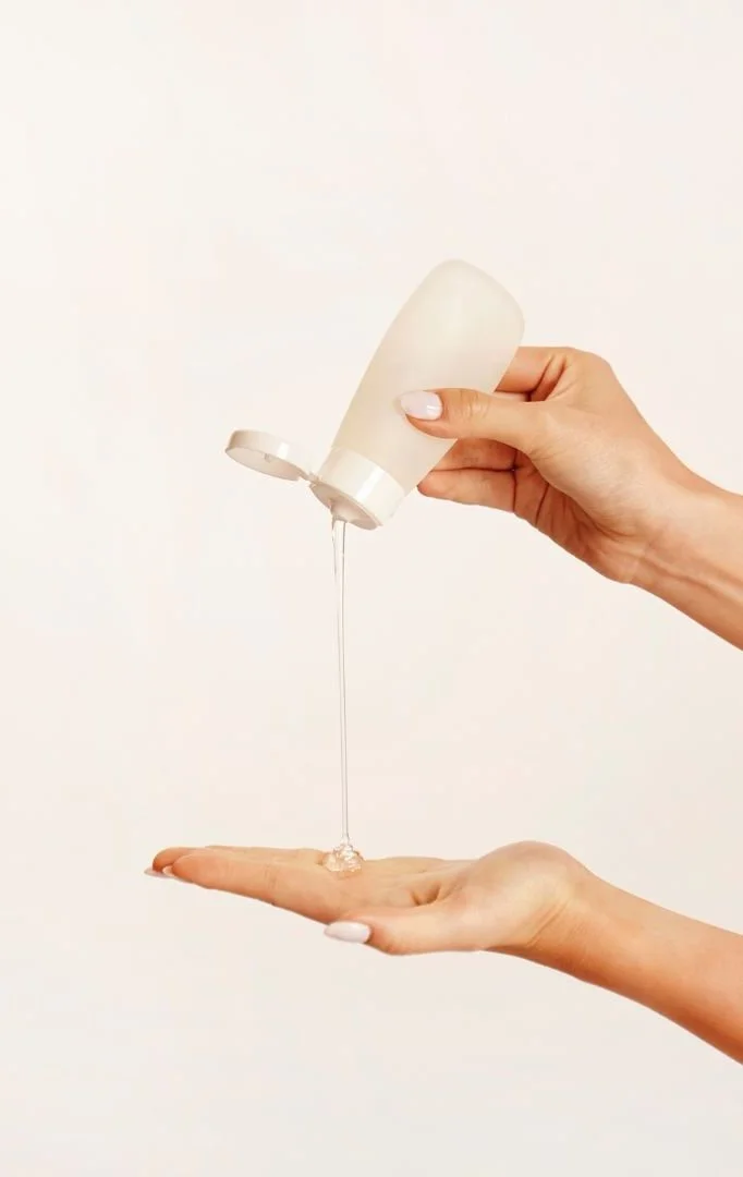 Skincare product being dispensed into a hand