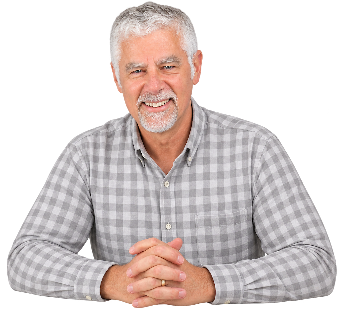 60 year old man smiling in grey shirt