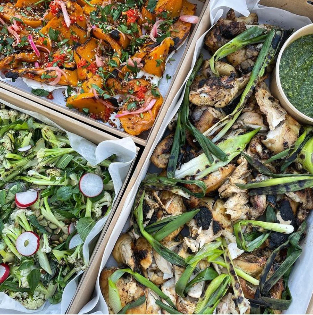 Trays of roasted vegetables and salads