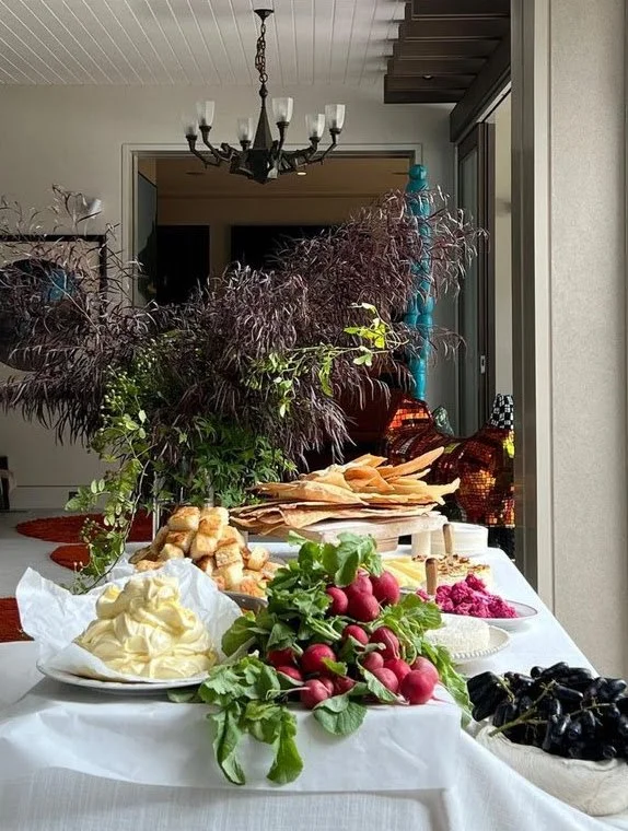 A dinner table set with flowers